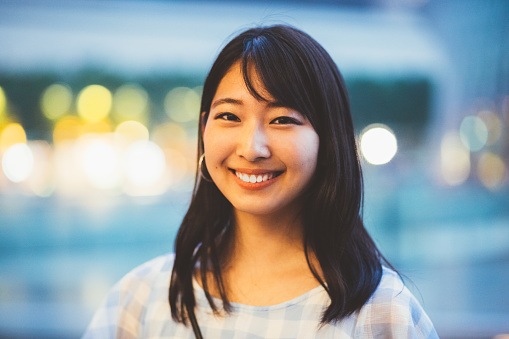 Portrait of beautiful young lady smiling to the camera